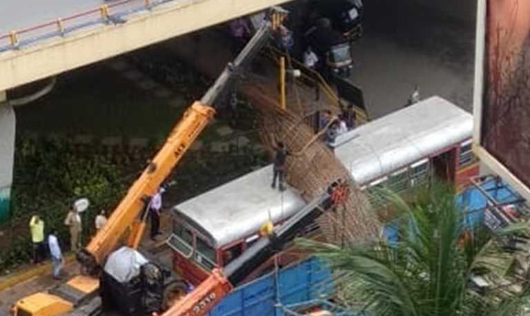 BEST Bus damaged when an Iron mesh of Metro rail falls on it Kandivali