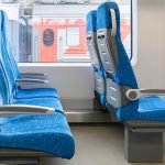 inside-wagon-train-interior-passenger-train-with-empty-blue-fabric-seats-scaled