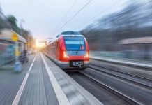 The dynamic period of growth, setting the trend for future mobility Passenger high speed red train with motion blur in station