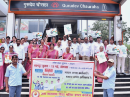 Educators with banner at Gurudev Chauraha Metro to Educate First-Time Voters